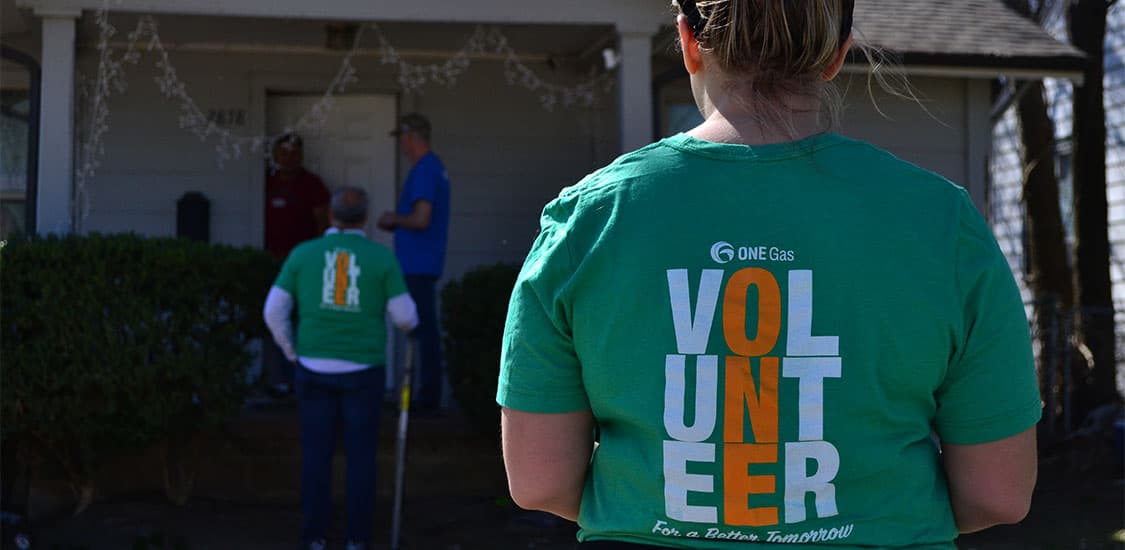 ONE Gas volunteer with volunteer t-shirt